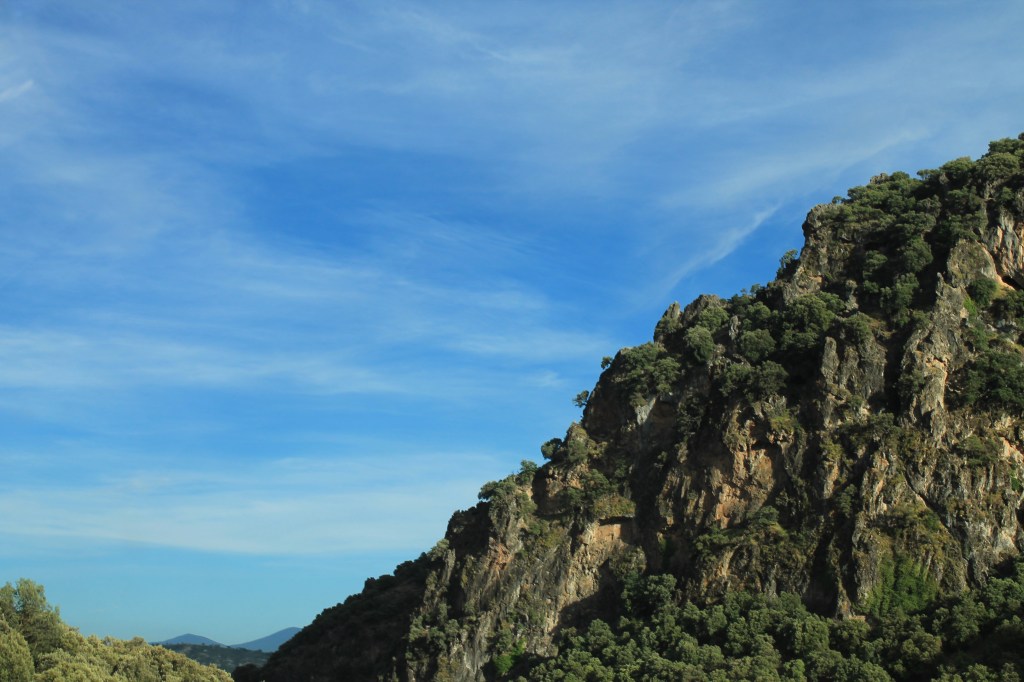 craggy cliff against blue sky