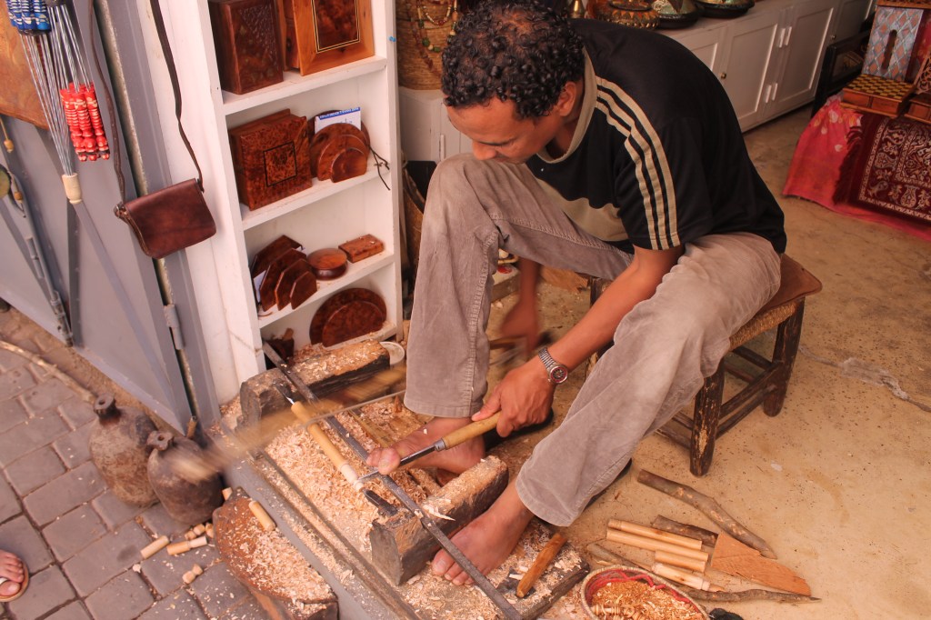 wood carver at work in shop