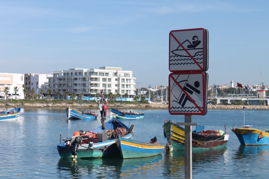 boats and caution signs