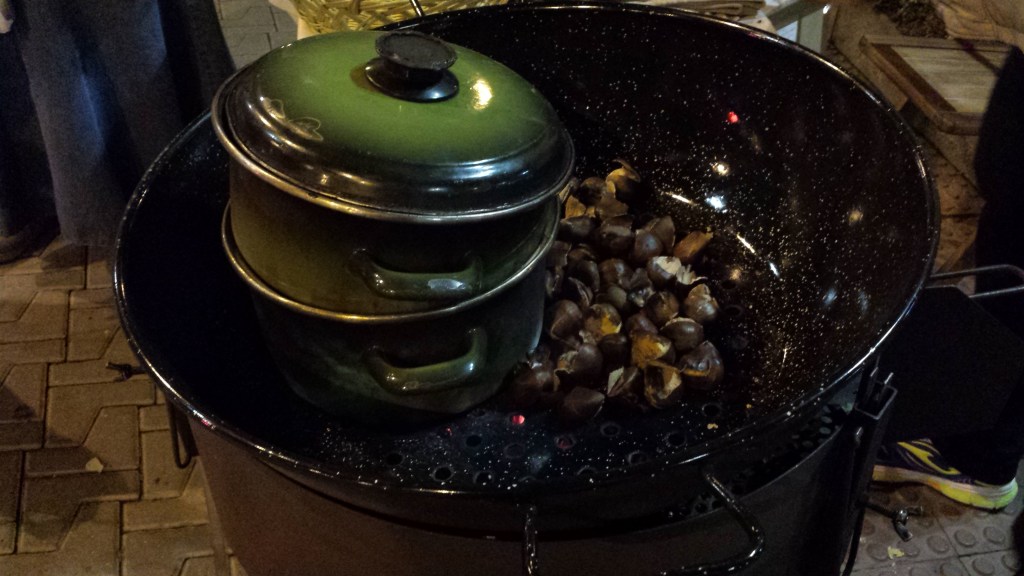 chestnuts roasting in a pan over a fire
