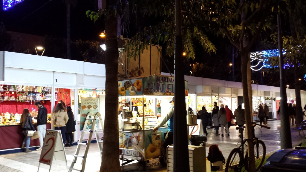 brightly lit row of market stalls
