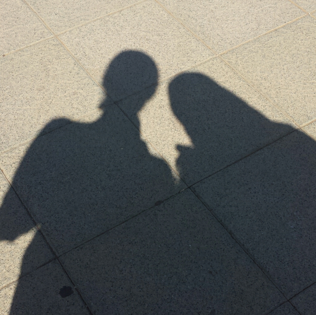 silhouette of two women