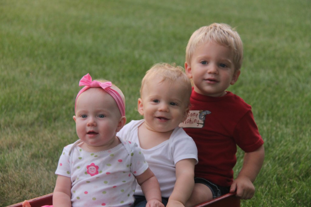 three young children in wagon