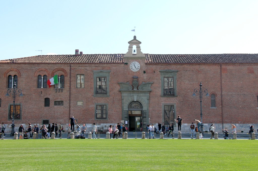 tourists posing on posts