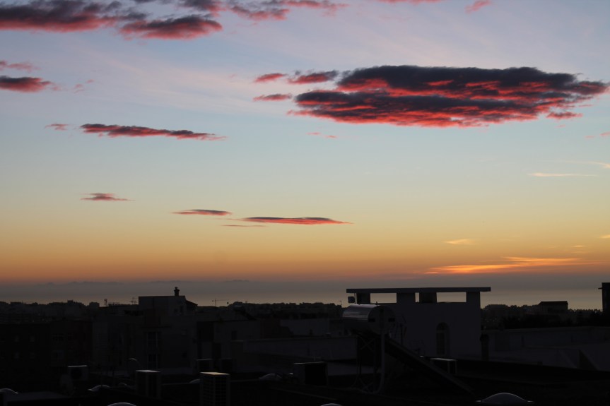 pink clouds over town