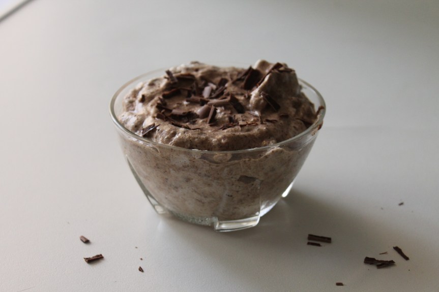 small dish of chocolate mousse with chocolate shavings