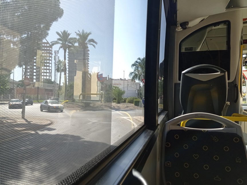 city streets from bus window