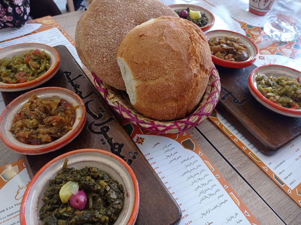 bread and small dishes of various salads